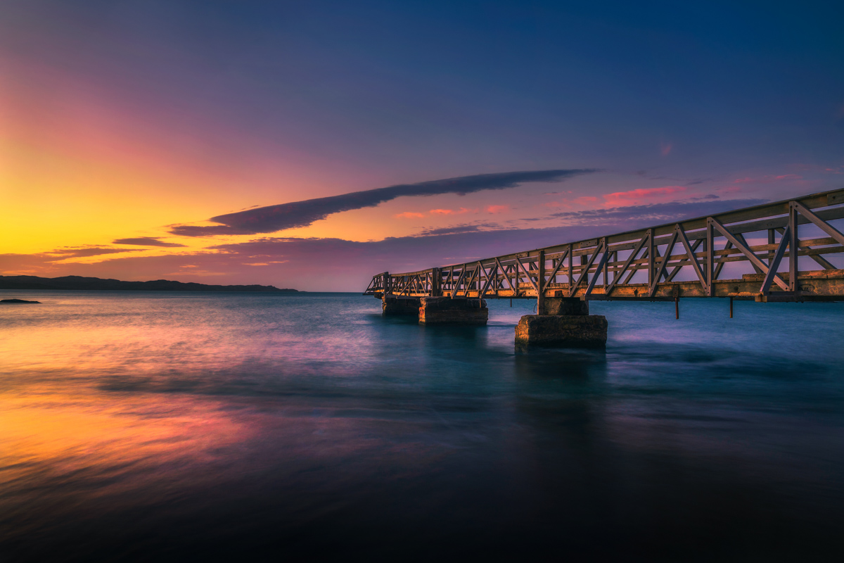 Pier In The Port Of Luderitz At Sunset. Luderitz Is A Harbour To